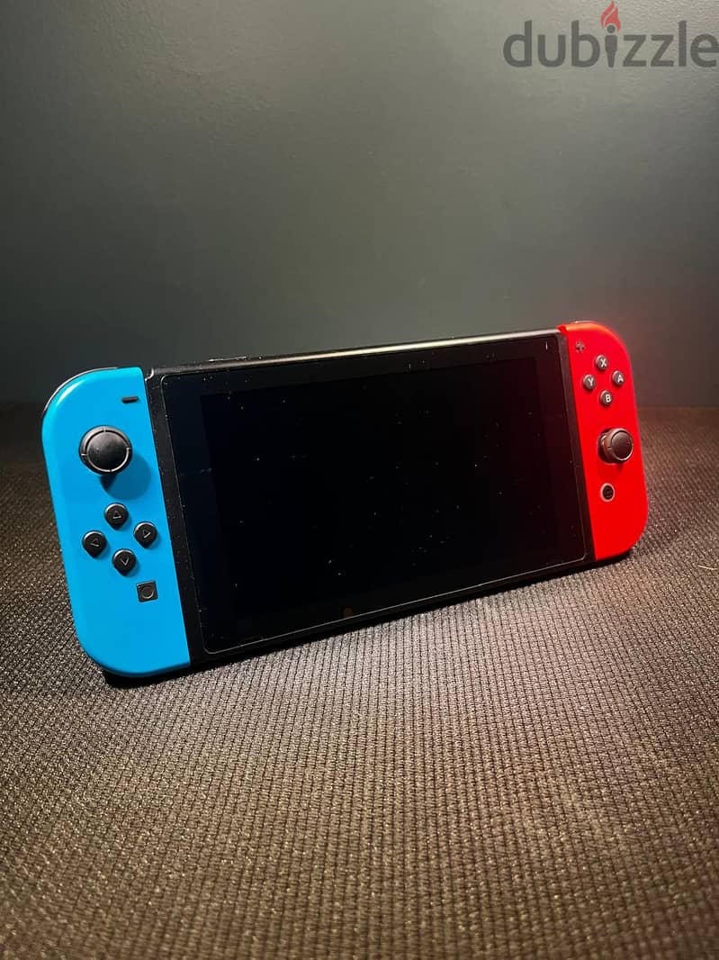 Nintendo Switch™ with Neon Blue and Neon Red Joy‑Con with accessoires 1