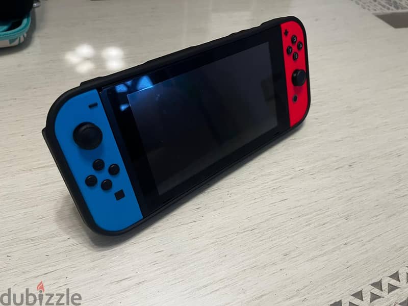 Nintendo Switch™ with Neon Blue and Neon Red Joy‑Con with accessoires 10