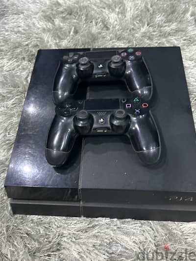 playstation 4 fat 1tb with 2 controllers