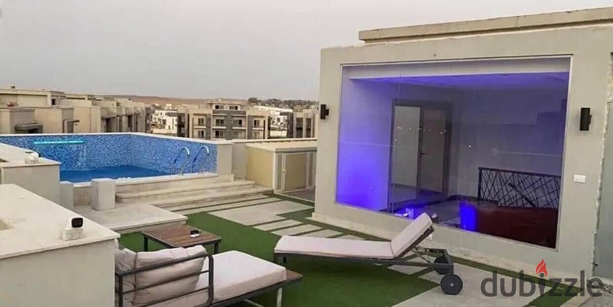 In installments over 12 years, a large penthouse apartment with a roof in New Cairo, New Cairo, on the Suez Direct Road, minutes from the 90th, and ne 0