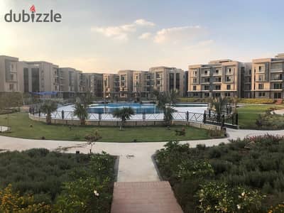 ground apartment with garden for sale fully finished & overlooking swimming pool & landscape direct at galleria moon valley - new cairo