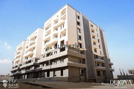 For sale, a 2-room garden apartment with a down payment of 300,000 in New Cairo, on the central axis and two minutes from the Green River