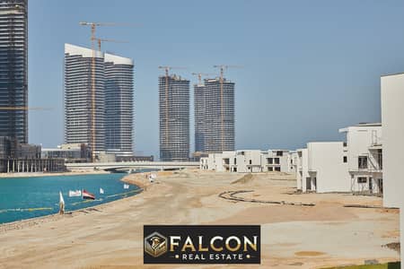 For sale, first row chalet on the sea, double view on Al Alamein Towers and the sea directly in the heart of the North Coast in Mazarin Village, with