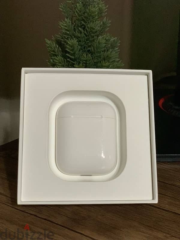 Apple AirPods with Charging Case in box ( Used )from Kuwait 1