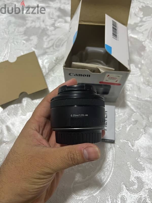 عدسة كانون EF 50mm f/1.8 STM بحالة  جديده 1