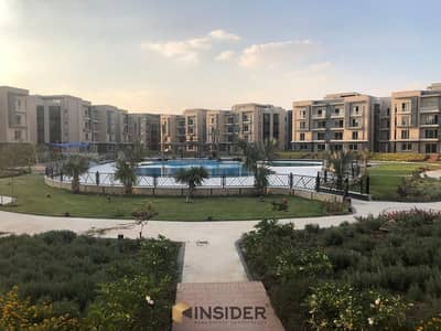 ground apartment with garden for sale fully finished & overlooking swimming pool & landscape direct at galleria moon valley - new cairo