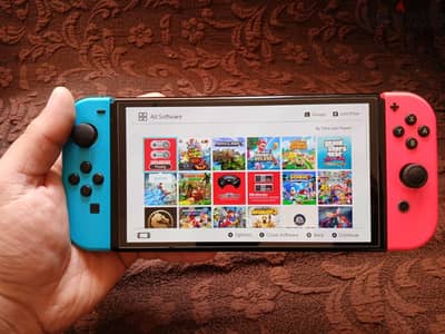 Nintendo Switch Oled معدل مليان ألعاب