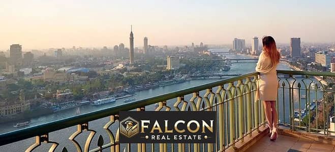 Receive immediately! Hotel suite with a direct view of Nile managed by Hilton - return in dollars - in NILE PEARL next to Hilton Maadi