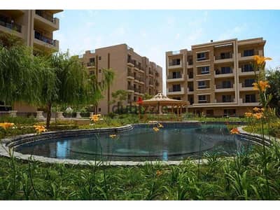 Apartment for sale in Taj City Compound, with a prime location in ZONE T, with a distinctive view directly on the swimming pool