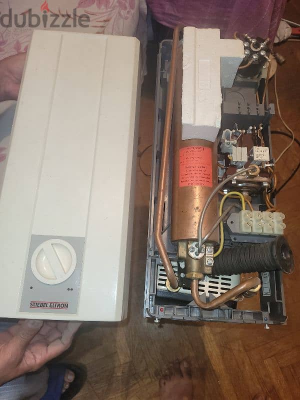 repair tankless water heater صيانه سخان مياه فوري  وكذالك الدفايات 3