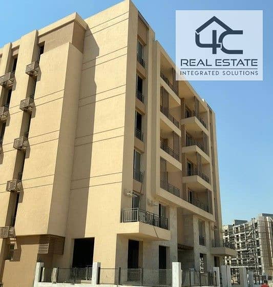 Apartment for sale in installments on a very special view on the landscape in front of Cairo Airport in the Taj City Compound 0