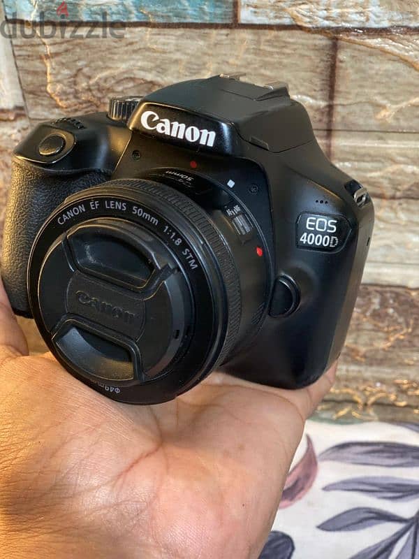 canon D4000 lens 50m stm كسر زيرو بكل مشتملاتها وفلاش 680 1