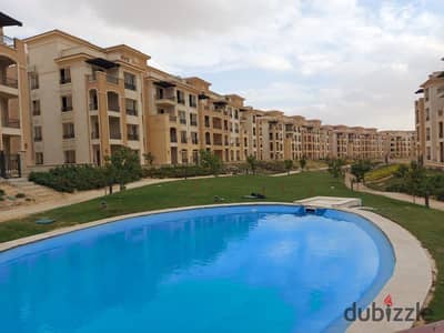 Apartment with garden for sale in Stone residence new cairo with down payment and installment