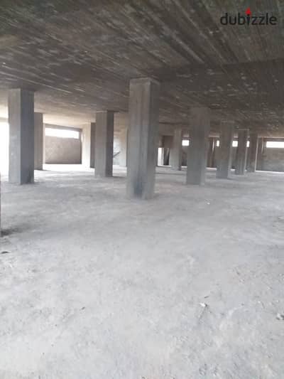 Concrete warehouse for rent, area of ​​700 square meters, Public storage license, industrial zone, Alef Assembly Factory, New Cairo