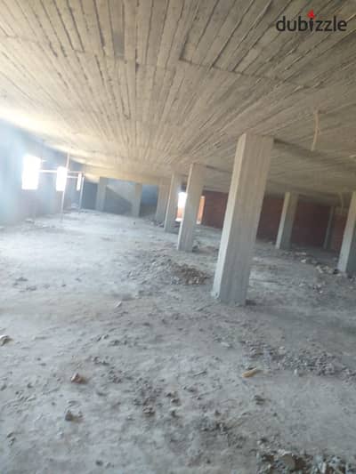 Concrete warehouse for rent, area of ​​1400 square meters, food license, industrial zone, Alef Assembly Factory, New Cairo