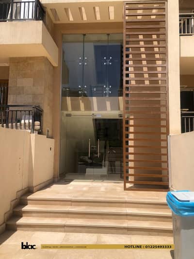 Apartment with garden for sale with immediate delivery in T-Zone area, semi-finished, located in Taj City Compound, New Cairo