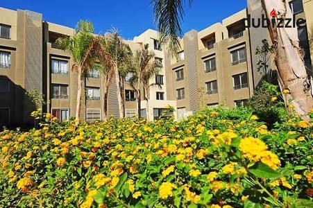 An apartment with a garden, fully finished, directly on the Dahshur link road in Palm Parks, for Yassin Mansour, available for installment payments