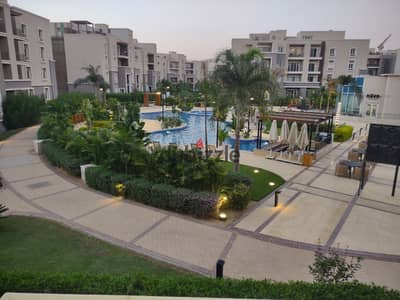 Apartment for sale with a distinctive view of the swimming pool, October Plaza Compound, Sodic, 6th of October