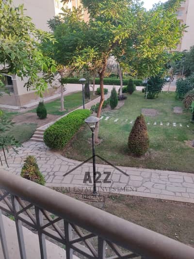 For rent, 141 sqm apartment, first floor, view of garden and torrent B2, Madinaty, next to services and the club