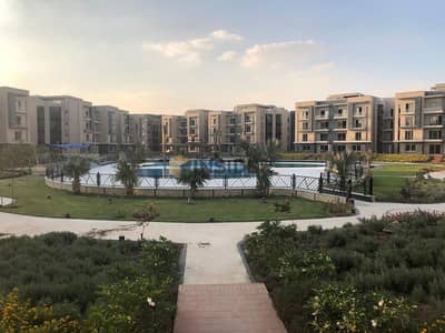 ground apartment with garden for sale fully finished & overlooking swimming pool & landscape direct at galleria moon valley - new cairo