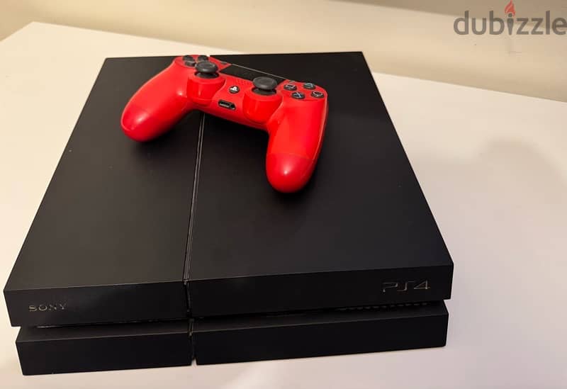 PlayStation 4 with red controller 2