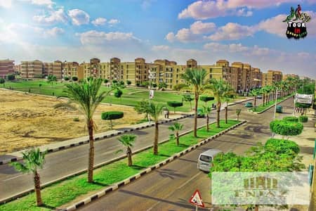 I own a plot of land in Sadat City, a very special location, the corner of a corridor, a very special plot, at less than the market price due to trave