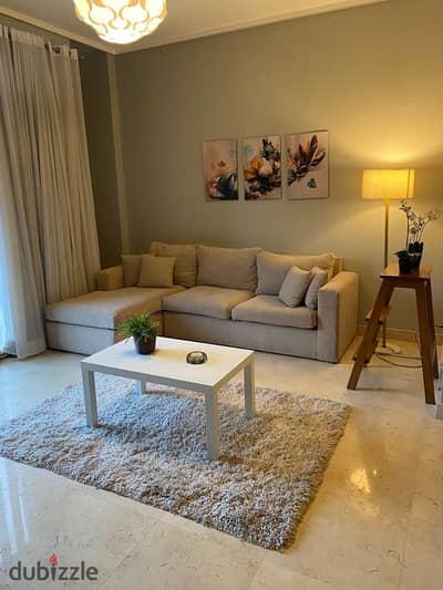 Best price Furnished Studio with garden for rent in The Village New Cairo