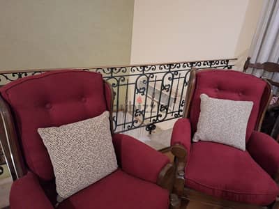 Two armchairs with cushions