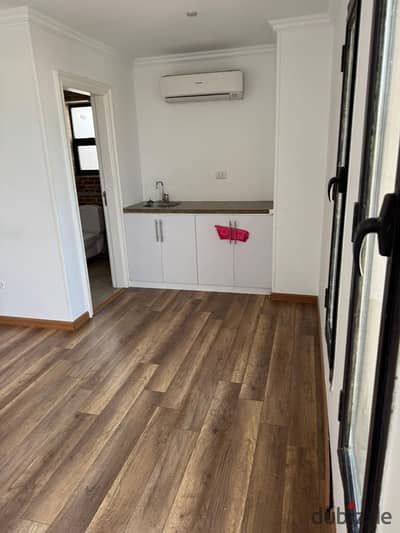 Studio for rent in Westown Sodic Zayed Compound Kitchen and air conditioners