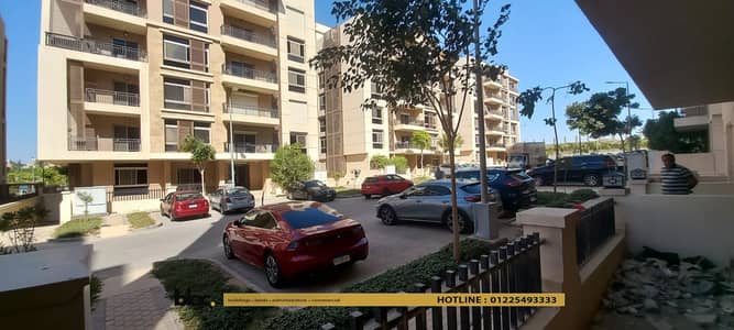 A ready-to-move-in apartment for sale, semi-finished, ground floor with a garden in Taj City Compound, New Cairo