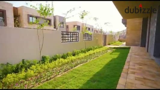 For sale in Taj City Compound, a townhouse villa, with installments over 8 years