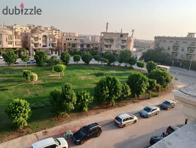 For lovers of large spaces and a distinctive view, an apartment for sale in Al Narges 4 villas with an open view, a square and Fatima Al Sharbatly Mos