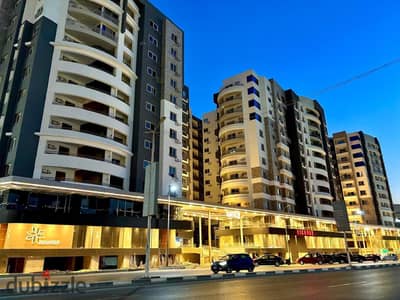 For sale, in installments, at a price of 2 million, a commercial store on Taha Hussein Street - New Nozha - an apartment