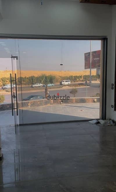 Shop for rent on Waslet Dahshur at a special price, internal area 100 m + 190 m outdoor area, near Mall of Egypt, 26 July Corridor, and Sheikh Zayed