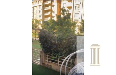 For sale in Madinaty, ground floor apartment with garden 128+55 meters, special finishes, view wide garden