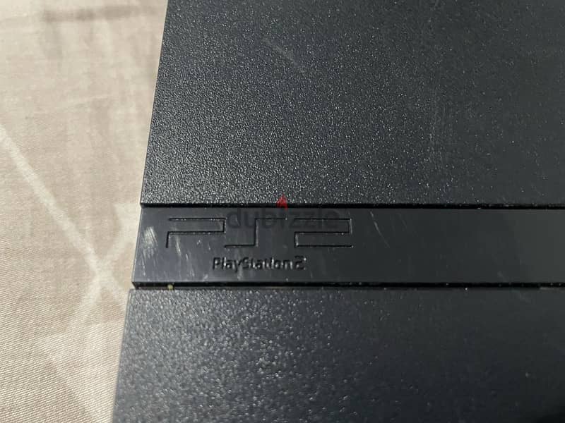 PS2 console with controller 2