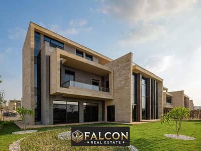 3-storey villa with a modern design in the best location and division in Taj City in front of Cairo Airport, with installments up to 12 years