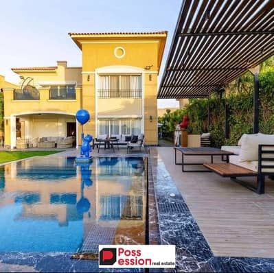 Villa with a private garden, 233 square meters, with 0% down payment and installments over 10 years next to the AUC Telal East  next to Palm Hills