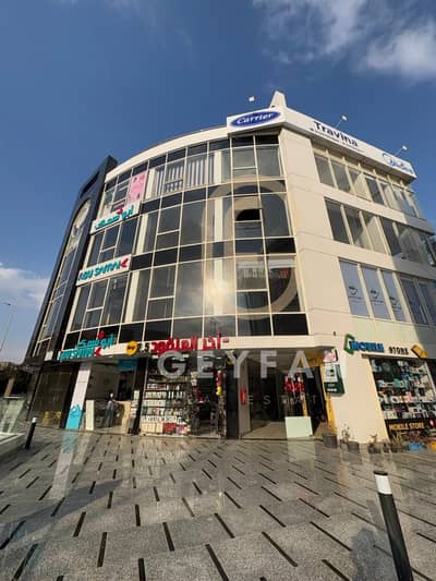 Shop for Rent – Mall Frontage, First Floor  - Area: 91 sqm   - Ceiling Height: 7 meters   - Location: First Settlement, Al-Banafseg Services, 2 minute