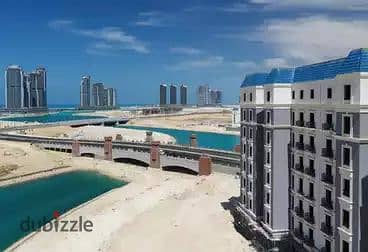 apartment for sale with a panoramic view of the lagoon ( flexible payment plans up to 12 years ) at Latin District New Alamein