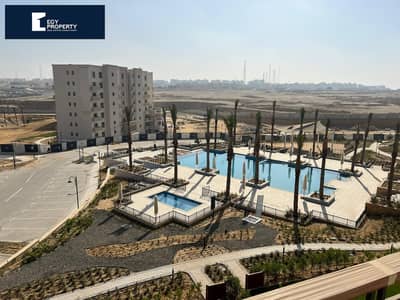 Lowest Price in Uptown Cairo Directly on Pool Fully Finished Apartment for Sale Ready to Move