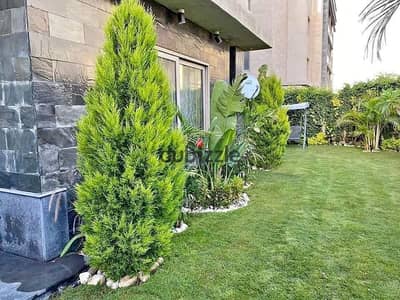 Apartment with garden, immediate receipt and finished, for sale in installments in the Fifth Settlement in Golden Square, minutes from Cairo Airport.