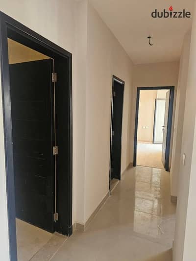 Apartment with garden, immediate delivery, finished, for sale and in installments in Address East Compound, next to Al-Ahly Club