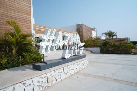 Chalet for sale in Ain Sokhna, direct view to the sea, 45 minutes from Cairo in Azha, finished with air conditioners and kitchen, delivery soon