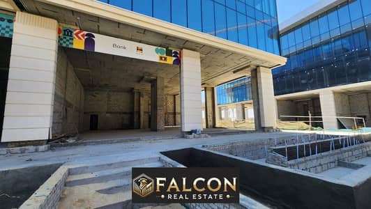 For sale a 100 sqm commercial shop in the Fifth Settlement in a prime location in New Cairo minutes from Madinaty and Rehab