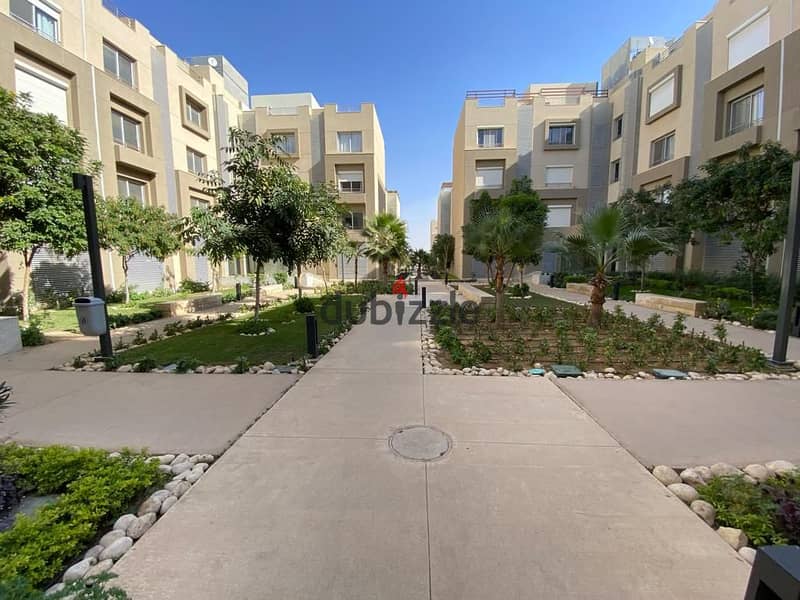 apartment for sale in  Palm Hills Village Avenue new cairo beside waterway ready to move under market price 0