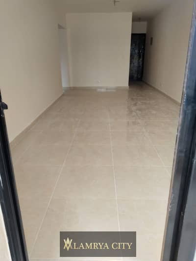 Resale apartment for sale in Ashgar City compound, fully finished, ready to move, area 132m, 3 bed, 2 bath, 2 balconies, and a north-facing view.