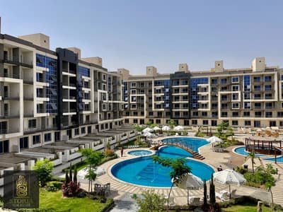 Apartment in Isola Sheraton Compound, down payment or cash 6,600,000 minutes from Cairo airport, on Al-Saiqa Street, near Hajoujah, close to services