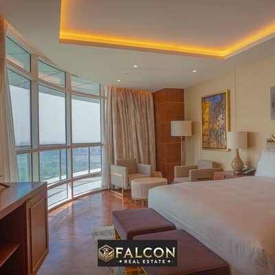 Luxurious hotel suite managed by Hilton Hotel, ready for delivery, top quality finishing, with a distinctive view of the Nile Corniche, Nile Pearl Tow