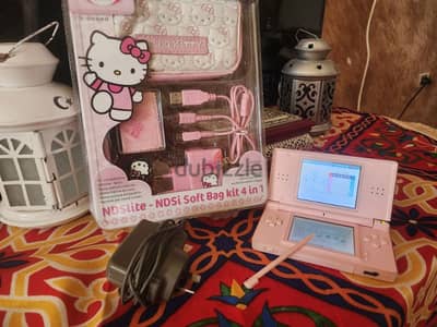 pink Nintendo ds lite with hello kitty accessories